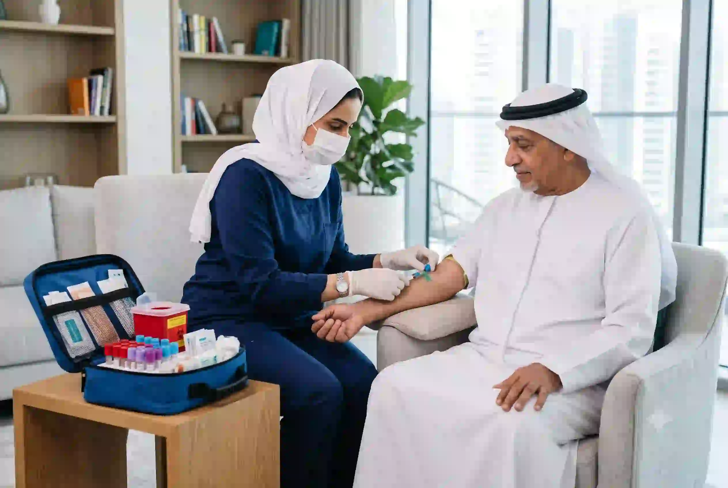 Healthcare professional performing home blood test in UAE